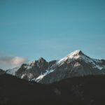 snow top mountain under clear sky