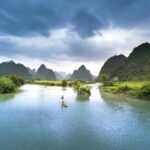 man on boat in lake